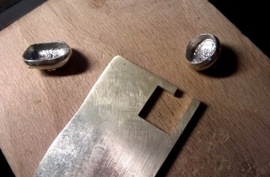 Slab with cast silver cups for stone setting